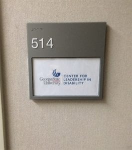Custom door sign for the Center for Leadership in Disability at Georgia State University, designed by Pinnacle Custom Signs. The sign includes the room number '514' in raised lettering and Braille, along with the center’s logo and name, providing clear identification and accessibility.