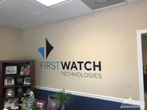 Wall graphic lobby sign for First Watch Technologies