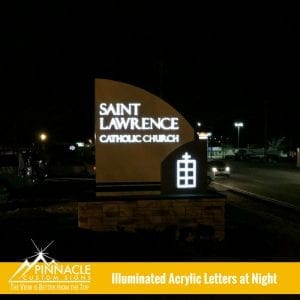 The view at night of the new lighted monument sign for Saint Lawrence Catholic Church